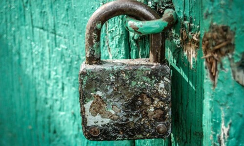 Rusty Padlock On Blue Door ALT
